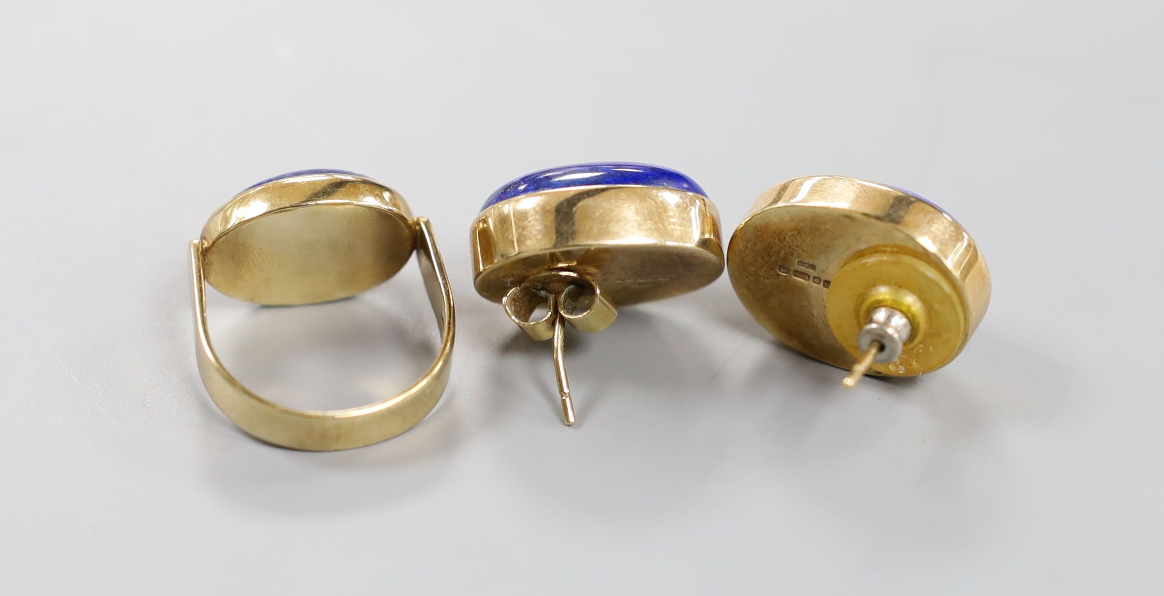 A pair of 9ct gold and lapis earrings, 21mm and a similar dress ring, size Q, gross weight, 27.2 grams.